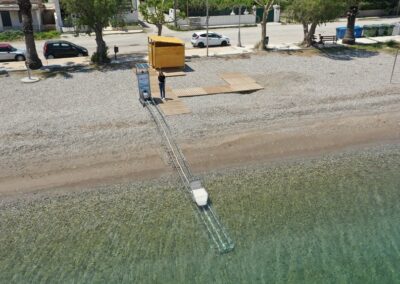 Top view of the Setrac device installed at the beach, remote control operated by a woman